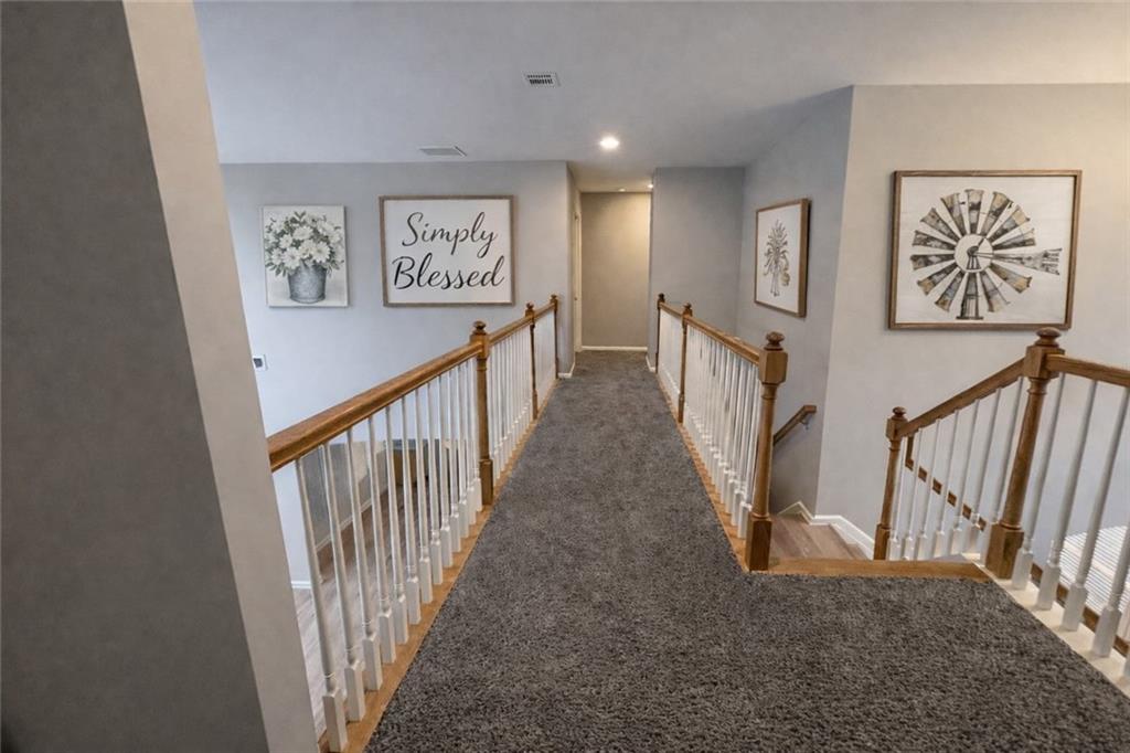 915 Bishops Crossing Norcross, GA 30071 - Photo 4 of 10 a view of a hallway with windows