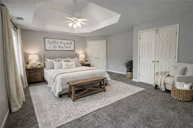 a bedroom with a bed and a couch