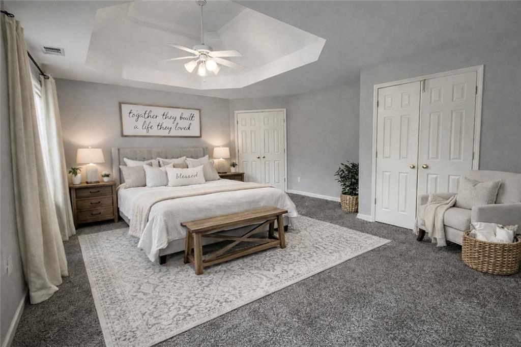 915 Bishops Crossing Norcross, GA 30071 - Photo 5 of 10 a bedroom with a bed and a couch