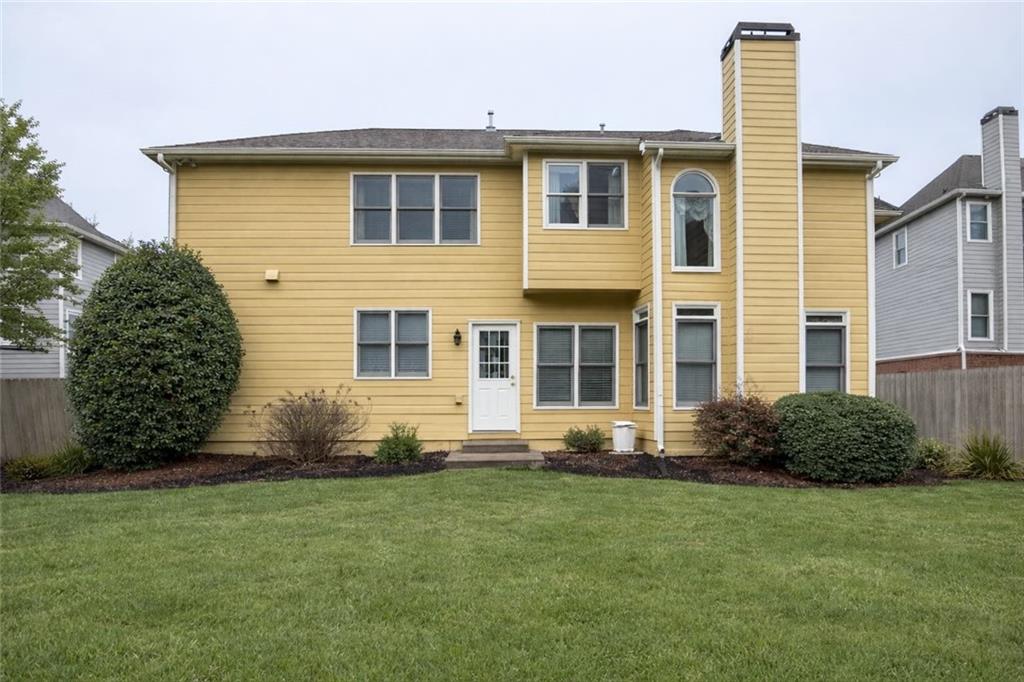 915 Bishops Crossing Norcross, GA 30071 - Photo 9 of 10 a front view of a house with a yard