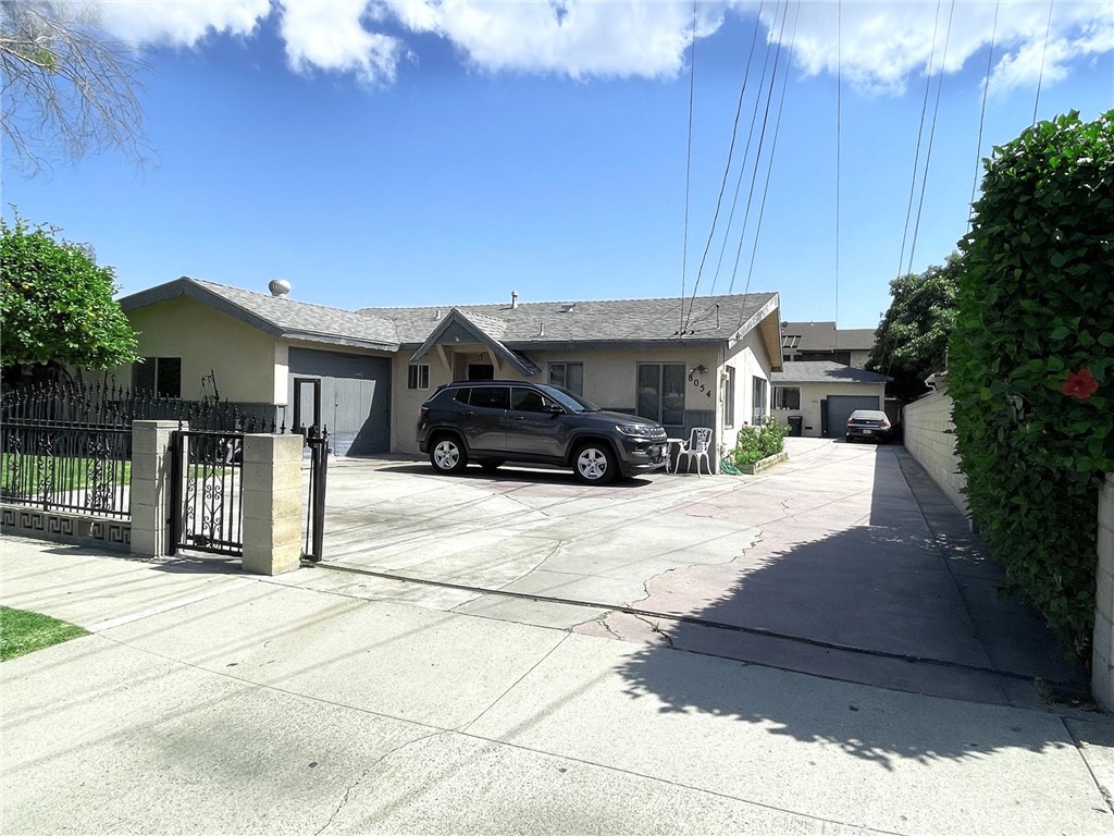 8052 Harrison Street Paramount, CA 90723 - Photo 1 of 1 a car parked in front of house