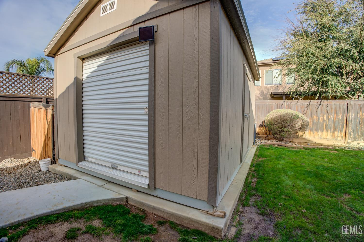 Undisclosed Address Shafter, CA 93263 - Photo 20 of 26 a house view with a backyard space