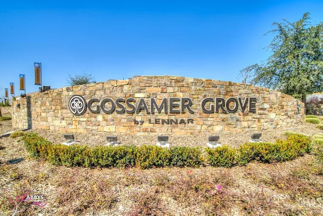 a sign board on the side of a road