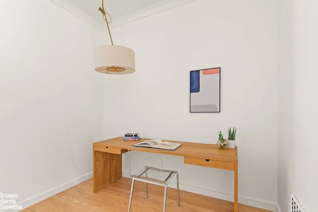 a kitchen with kitchen island granite countertop wooden cabinets and a sink