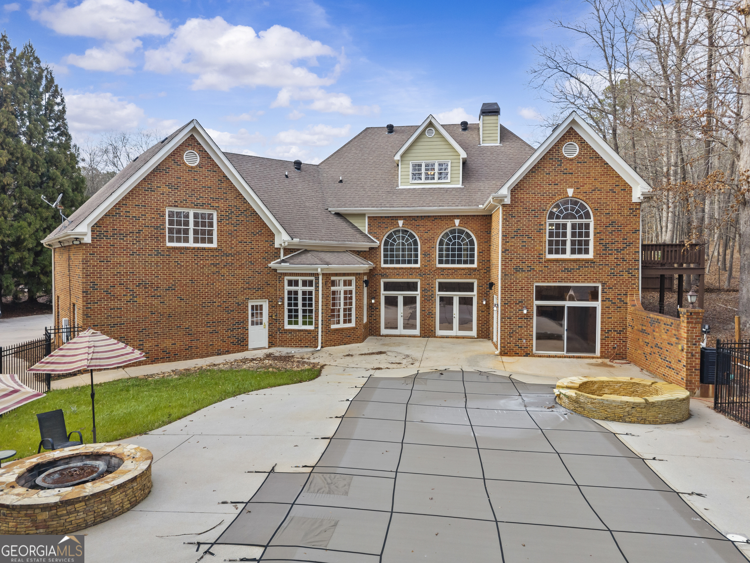 1171 River Run Bishop, GA 30621 - Photo 14 of 78 a view of a brick house with a yard plants and large tree