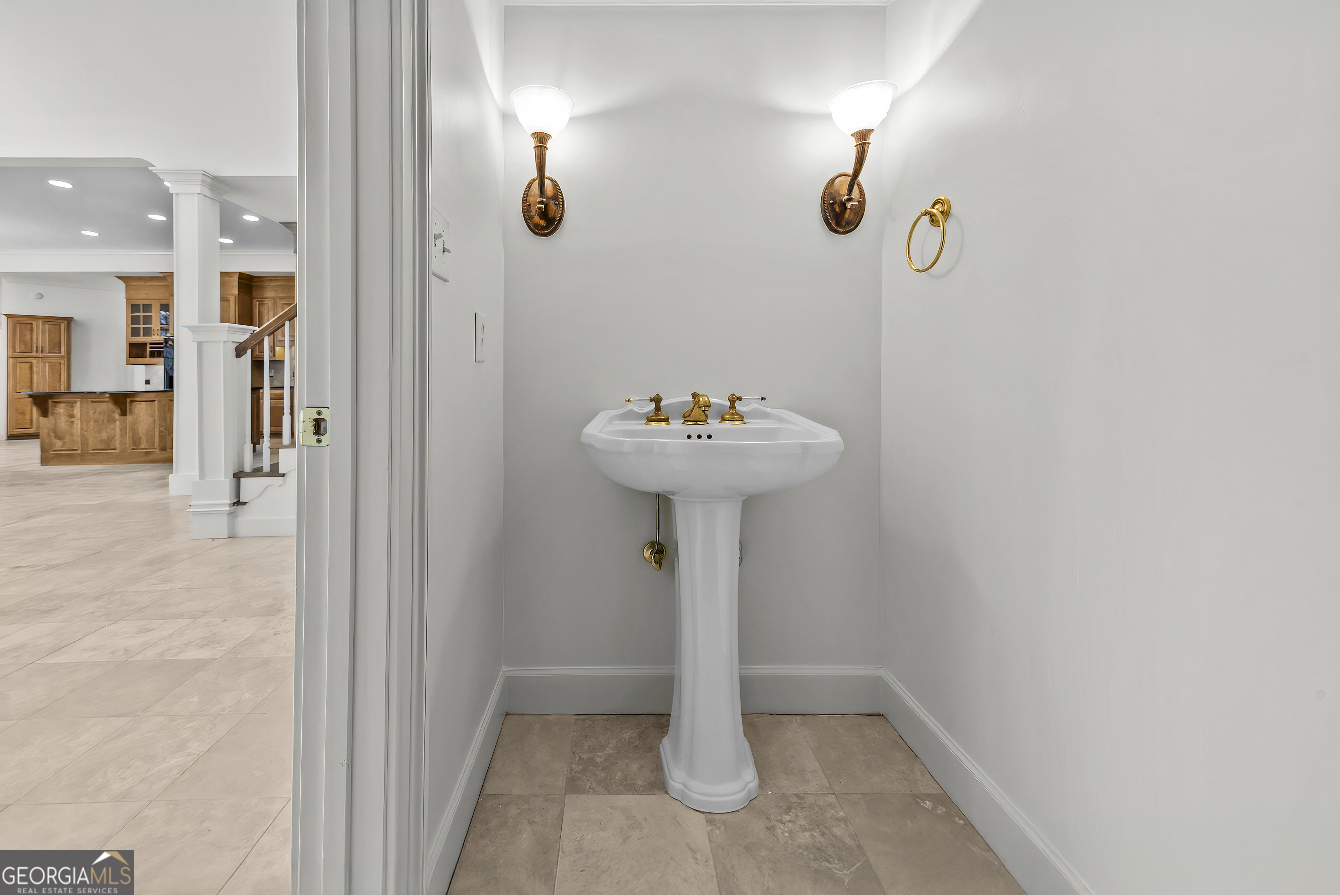 1171 River Run Bishop, GA 30621 - Photo 17 of 78 a bathroom with a sink a mirror and shower