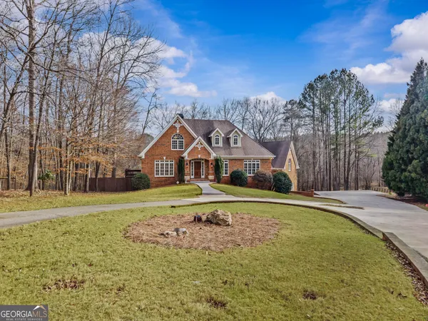 a front view of a house with a yard
