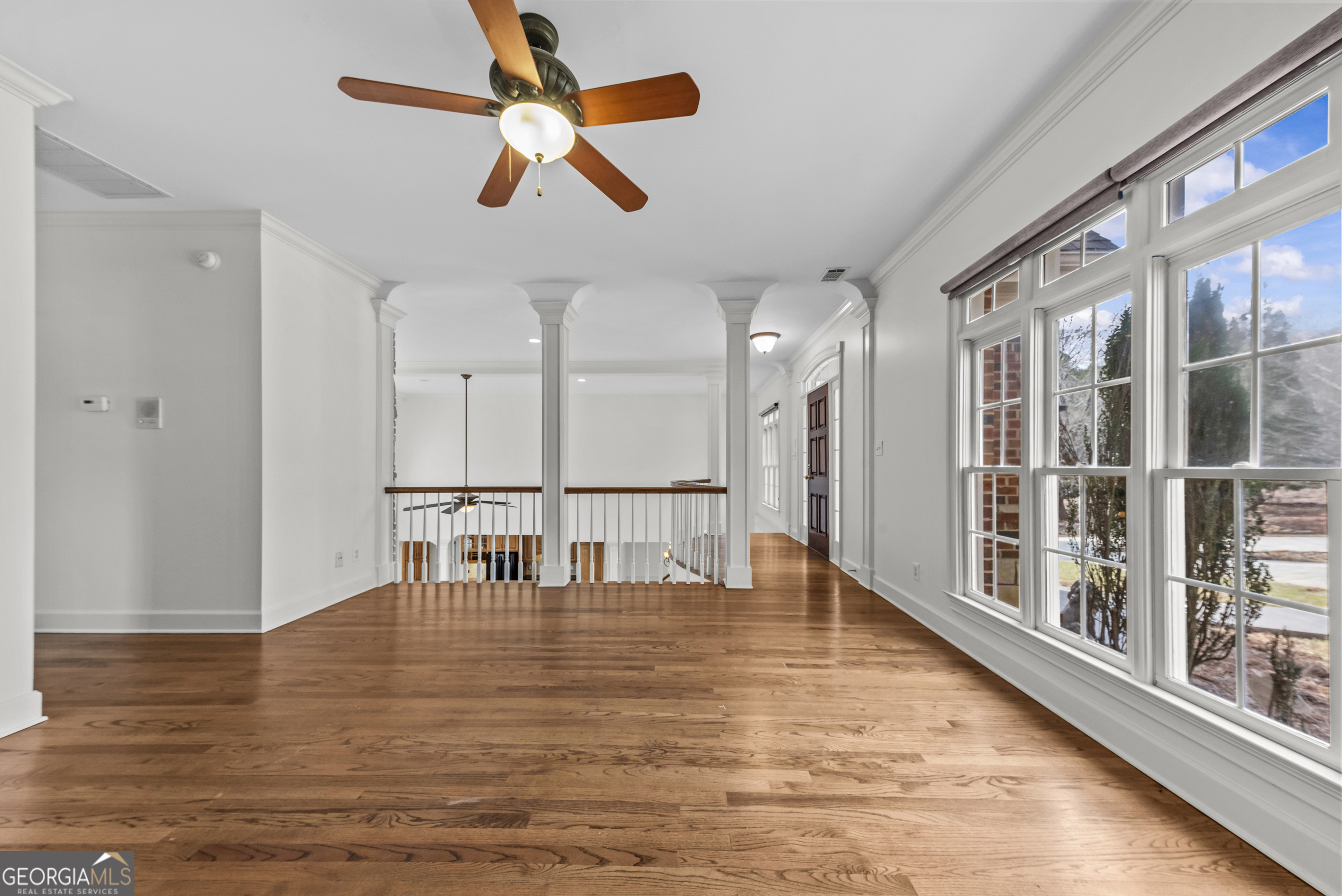 1171 River Run Bishop, GA 30621 - Photo 22 of 78 a view of empty room with wooden floor and fan