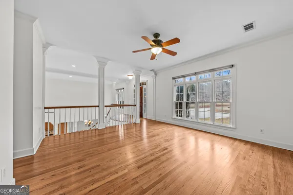 a kitchen with stainless steel appliances granite countertop a stove top oven a sink dishwasher and cabinets with wooden floor