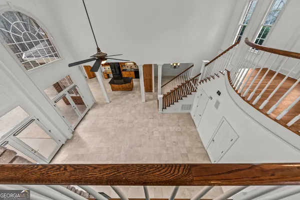a kitchen with stainless steel appliances granite countertop a stove top oven a refrigerator and a sink with granite countertops