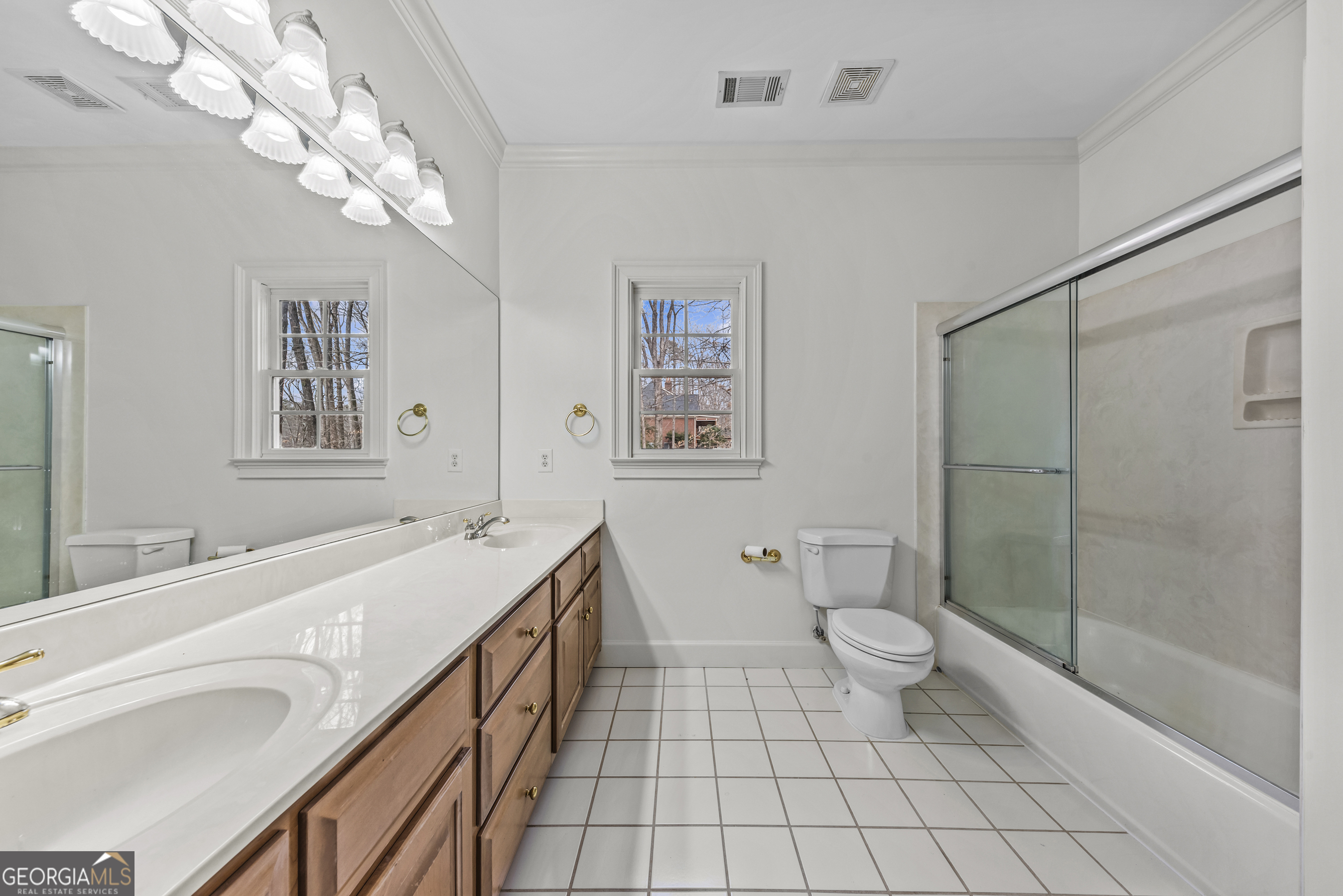 1171 River Run Bishop, GA 30621 - Photo 25 of 78 a bathroom with a double vanity sink mirror and toilet