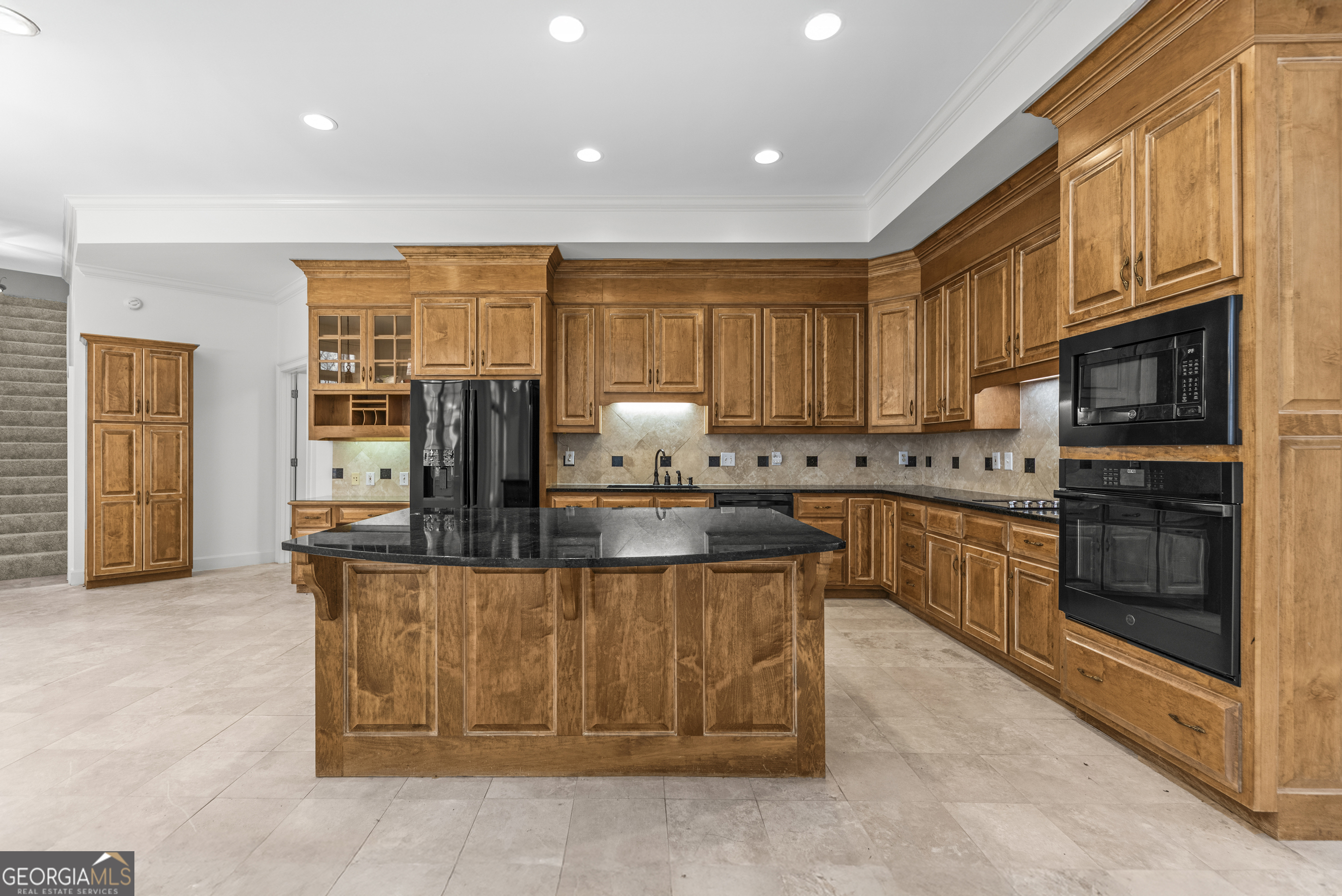 1171 River Run Bishop, GA 30621 - Photo 42 of 78 a kitchen with stainless steel appliances granite countertop a stove top oven a sink dishwasher and cabinets with wooden floor