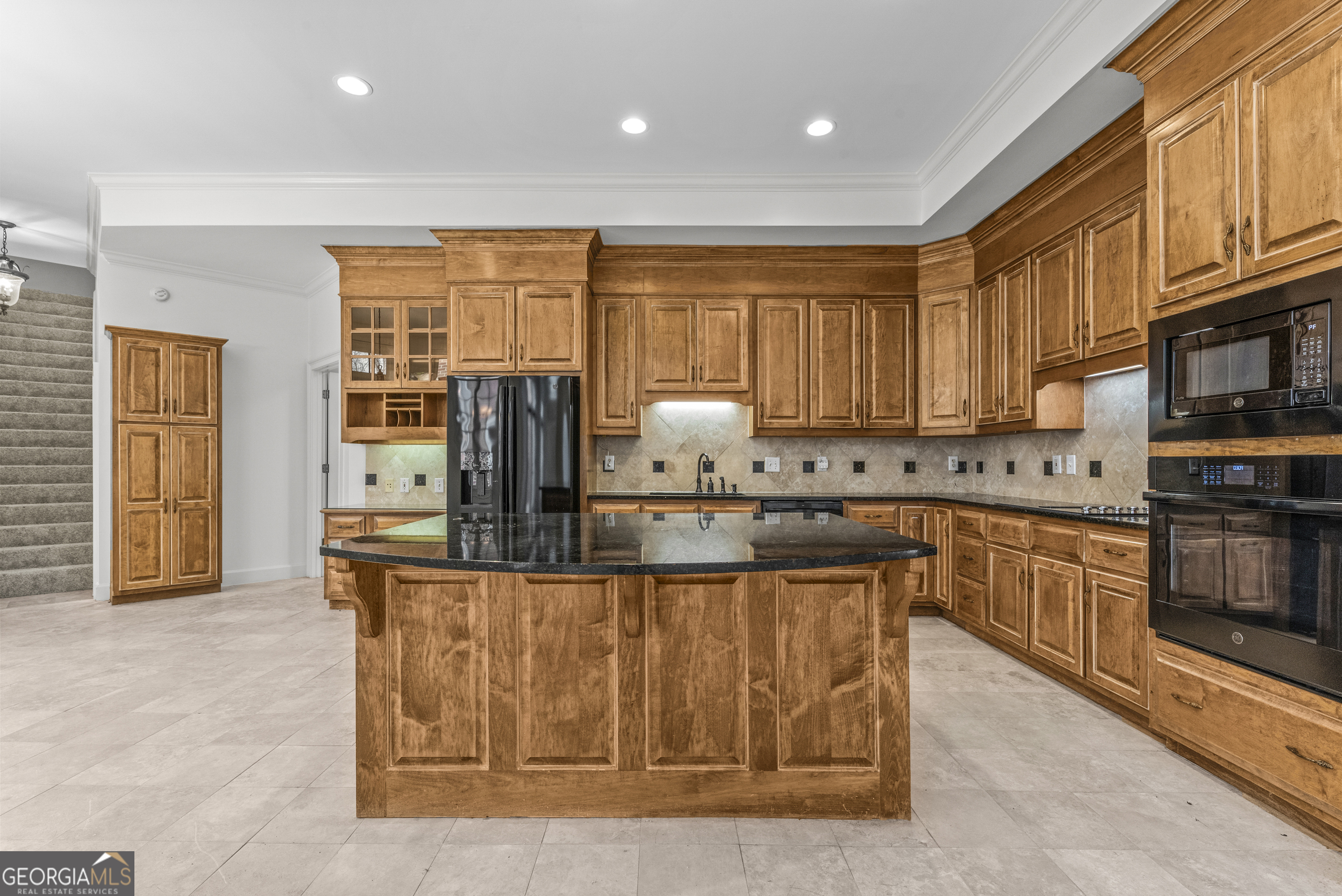 1171 River Run Bishop, GA 30621 - Photo 46 of 78 a kitchen with stainless steel appliances granite countertop a stove a sink and a microwave