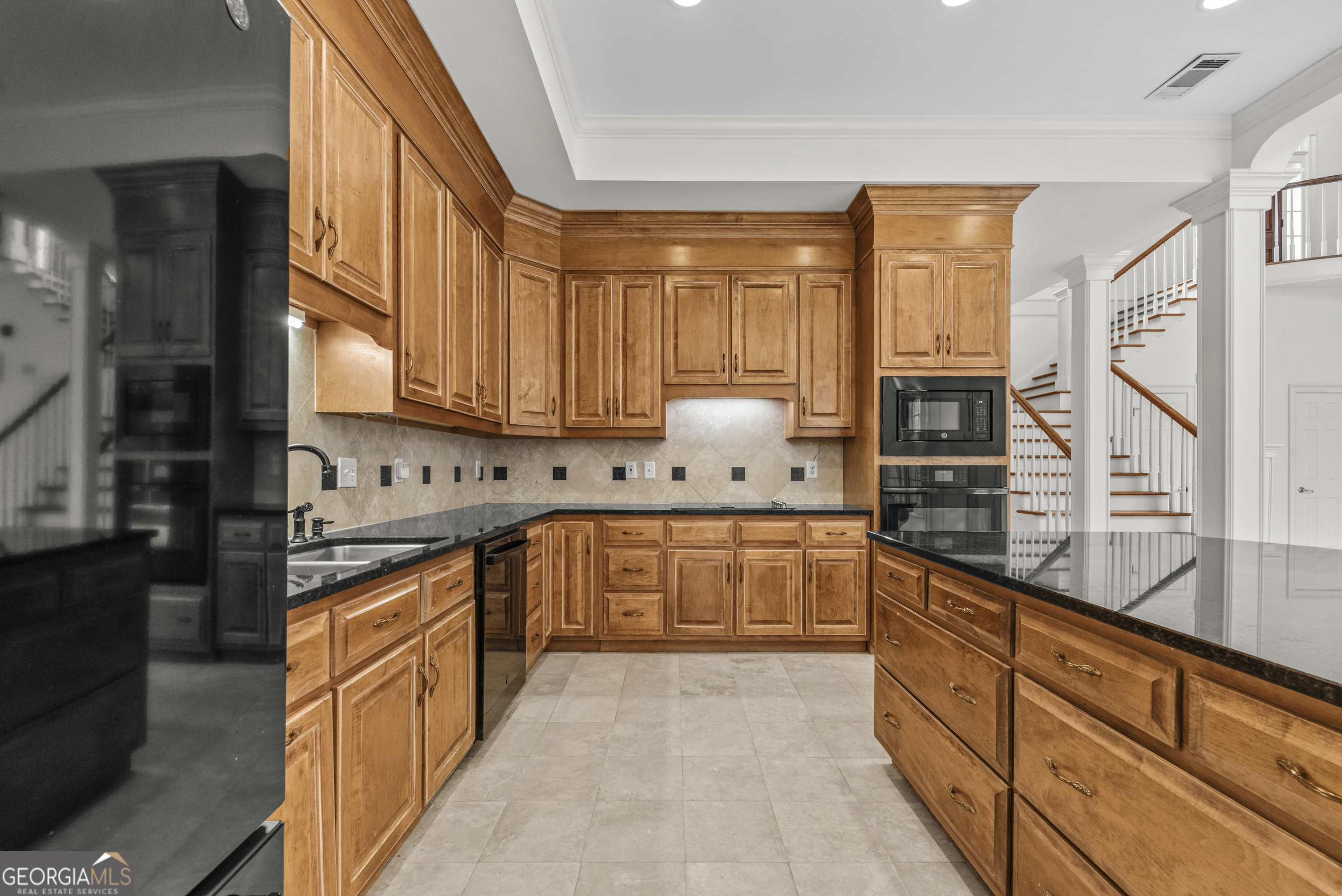 1171 River Run Bishop, GA 30621 - Photo 52 of 78 a kitchen with stainless steel appliances granite countertop a stove a sink and a refrigerator