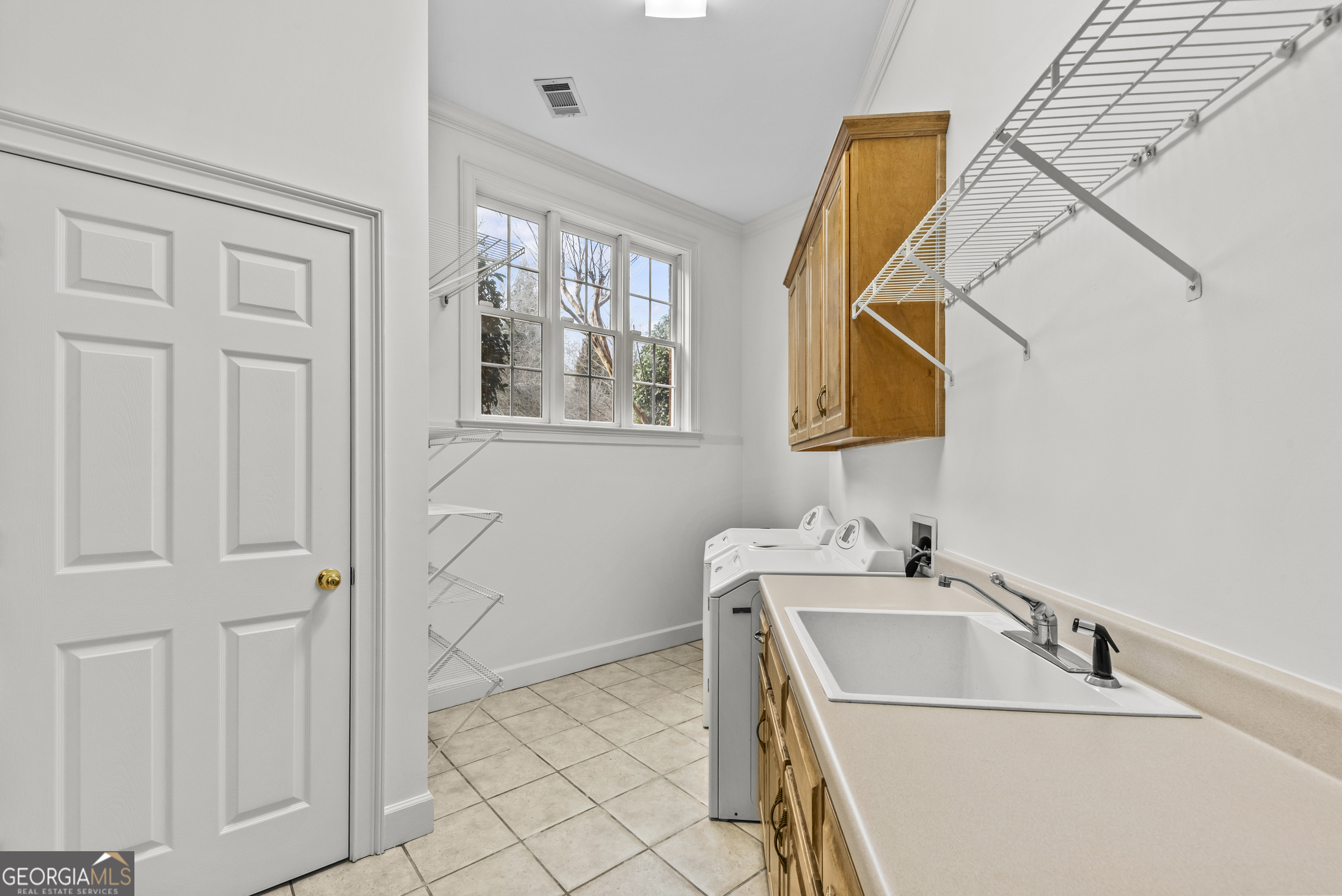 1171 River Run Bishop, GA 30621 - Photo 55 of 78 a bathroom with a sink and a mirror