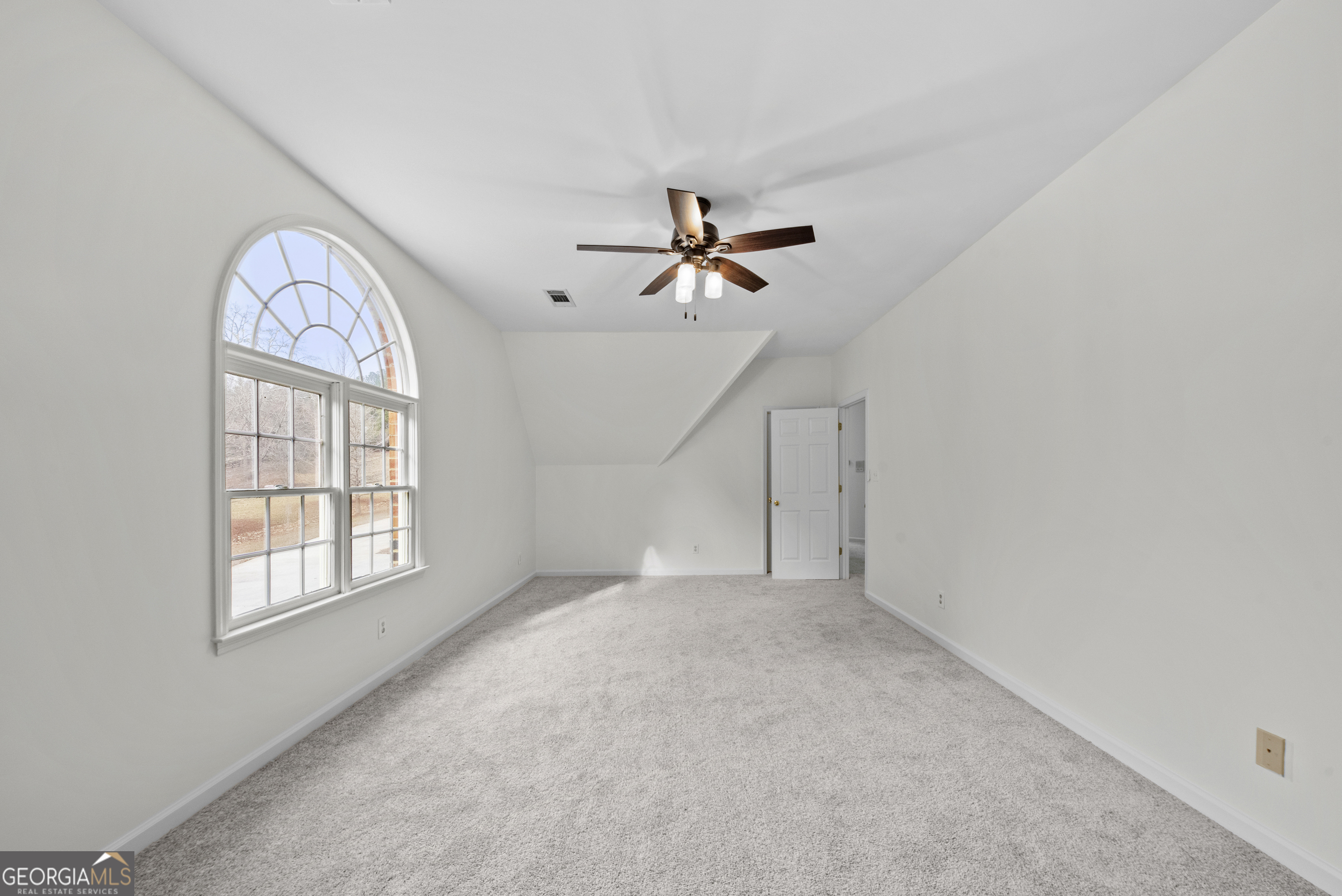1171 River Run Bishop, GA 30621 - Photo 59 of 78 an empty room with windows and ceiling fan