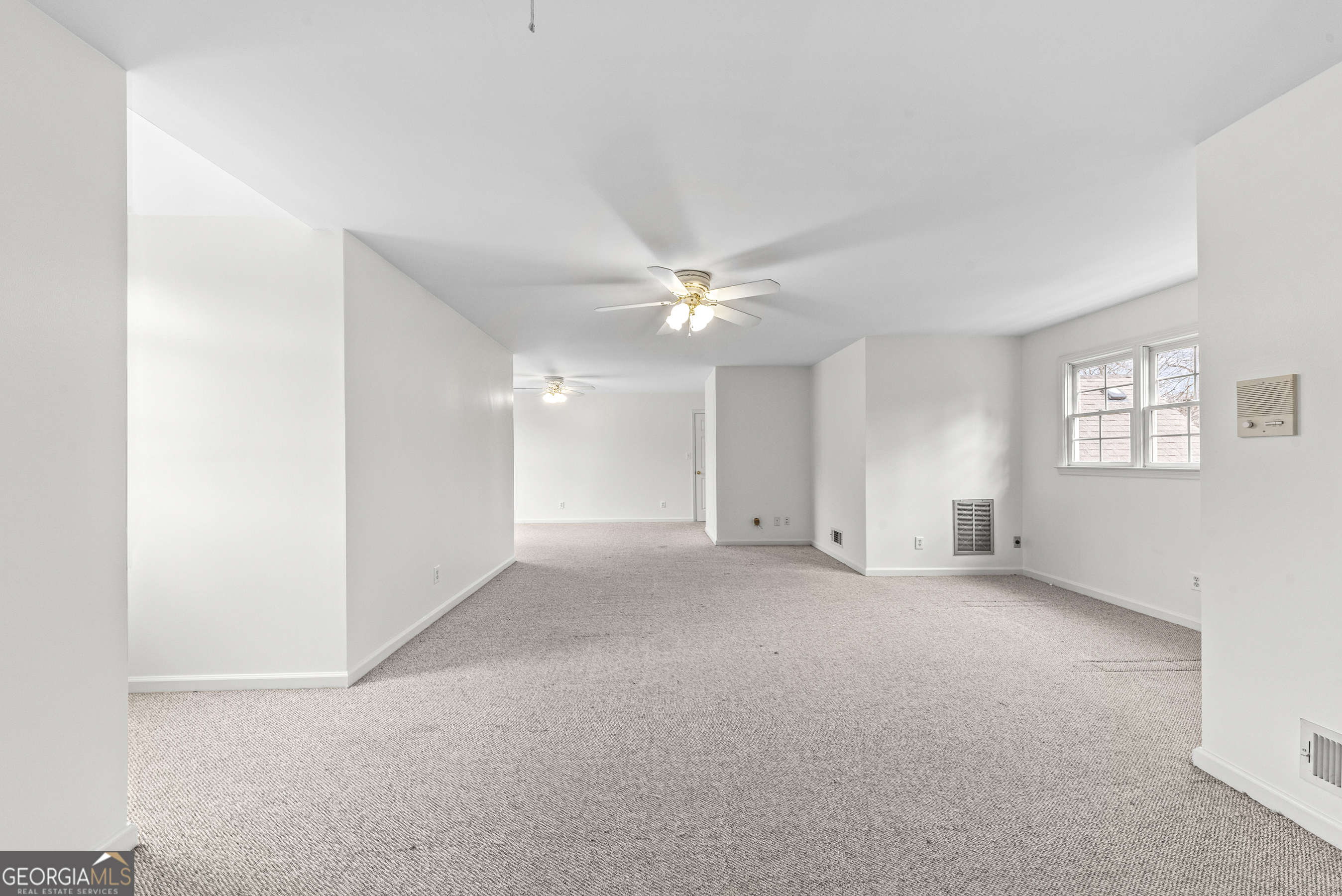 1171 River Run Bishop, GA 30621 - Photo 64 of 78 a view of a livingroom with a ceiling fan and window