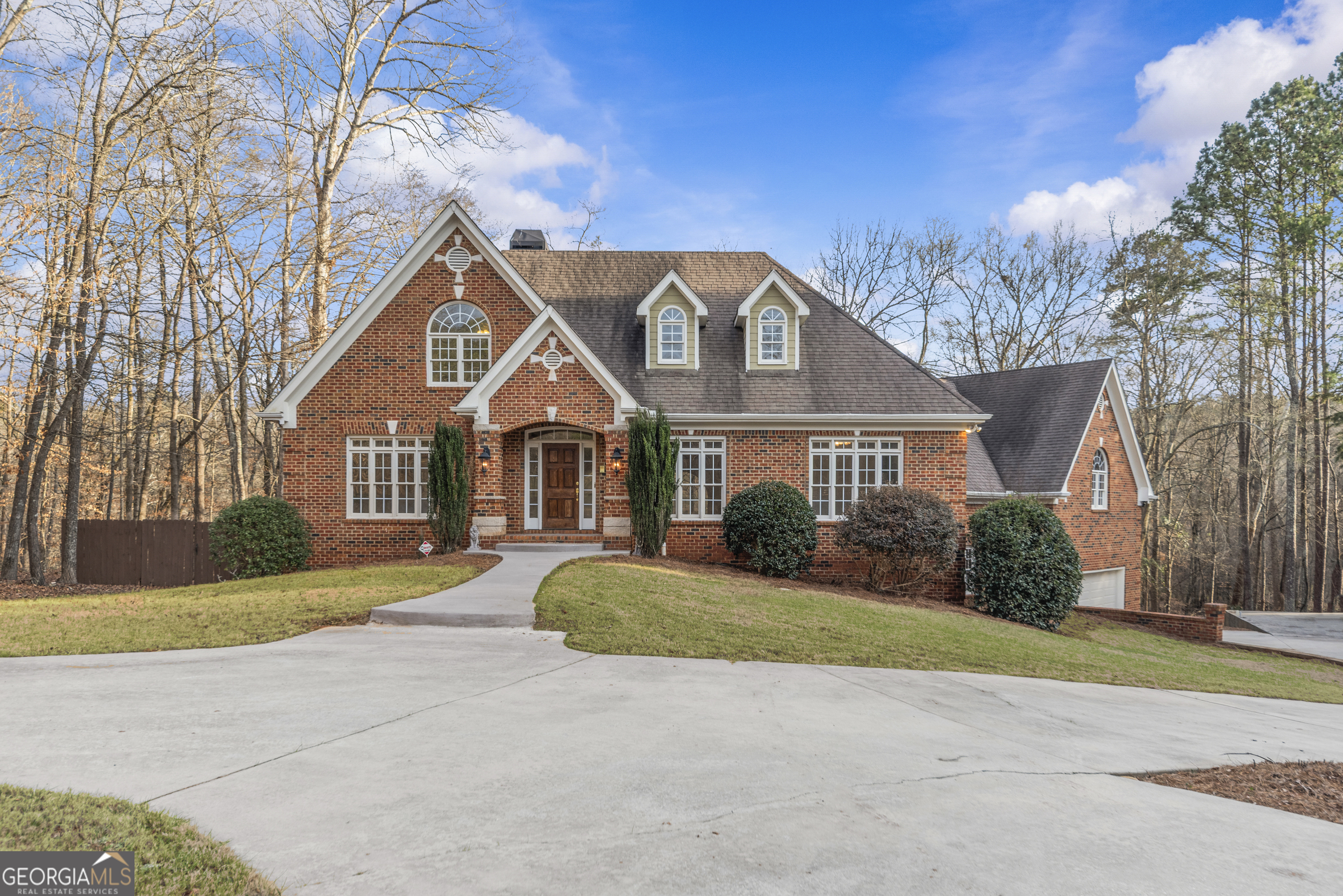 1171 River Run Bishop, GA 30621 - Photo 75 of 78 a front view of a house with a yard and garage