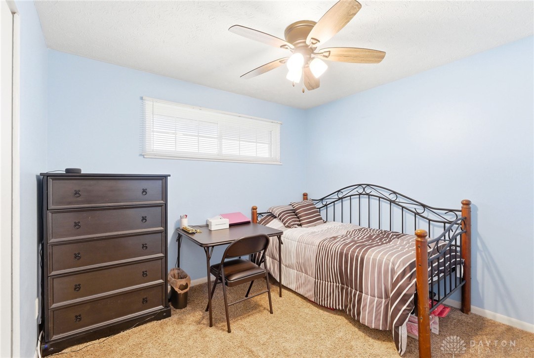 5171 Fishburg Road Dayton, OH 45424 - Photo 21 of 35 This cozy bedroom offers comfort and a tranquil ambiance for peaceful repose.
