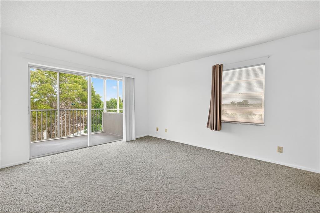 200 Pebble Beach Boulevard, Unit D406 Naples, FL 34113 - Photo 11 of 24 a view of an empty room with a window