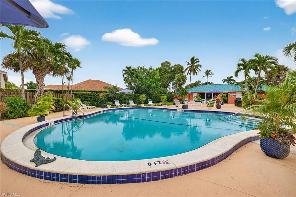 200 Pebble Beach Boulevard, Unit D406 Naples, FL 34113 - Photo 24 of 24 a view of swimming pool having outdoor seating