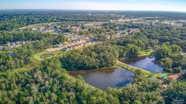 an aerial view of residential house with outdoor space