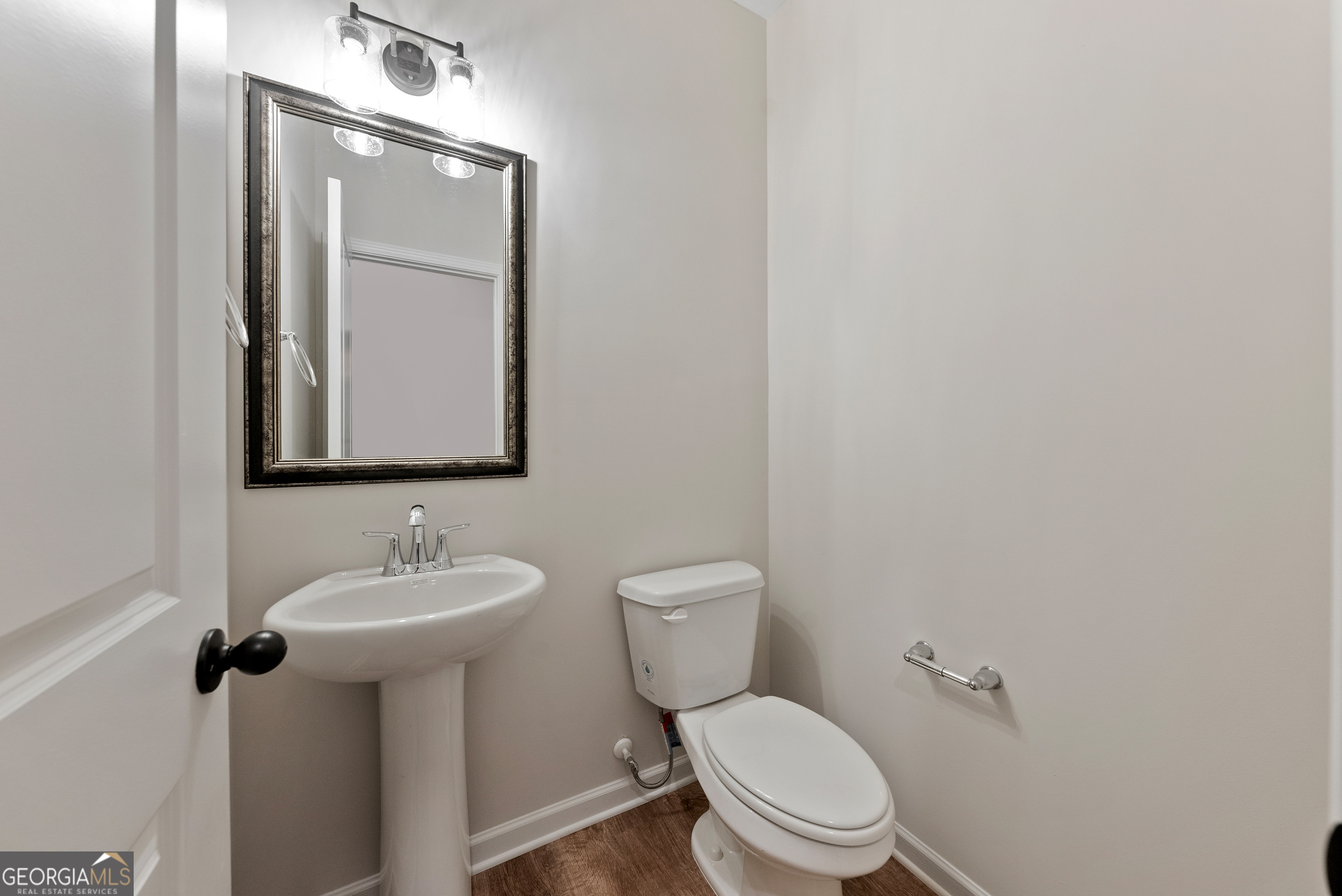 575 Bohannon Road, Unit 8 Grantville, GA 30220 - Photo 14 of 33 a bathroom with a toilet sink and mirror