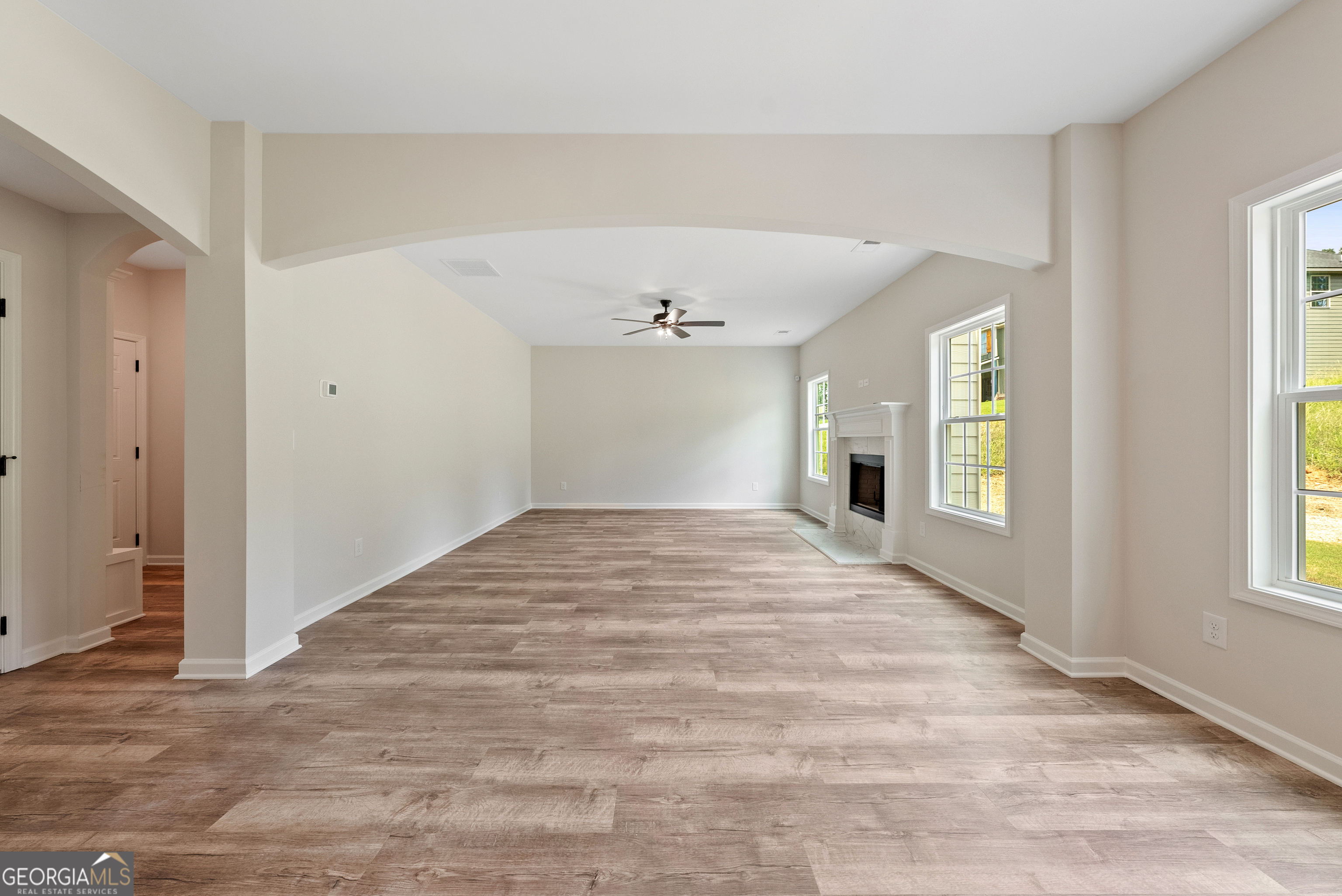 575 Bohannon Road, Unit 8 Grantville, GA 30220 - Photo 5 of 33 a view of empty room with wooden floor and fan