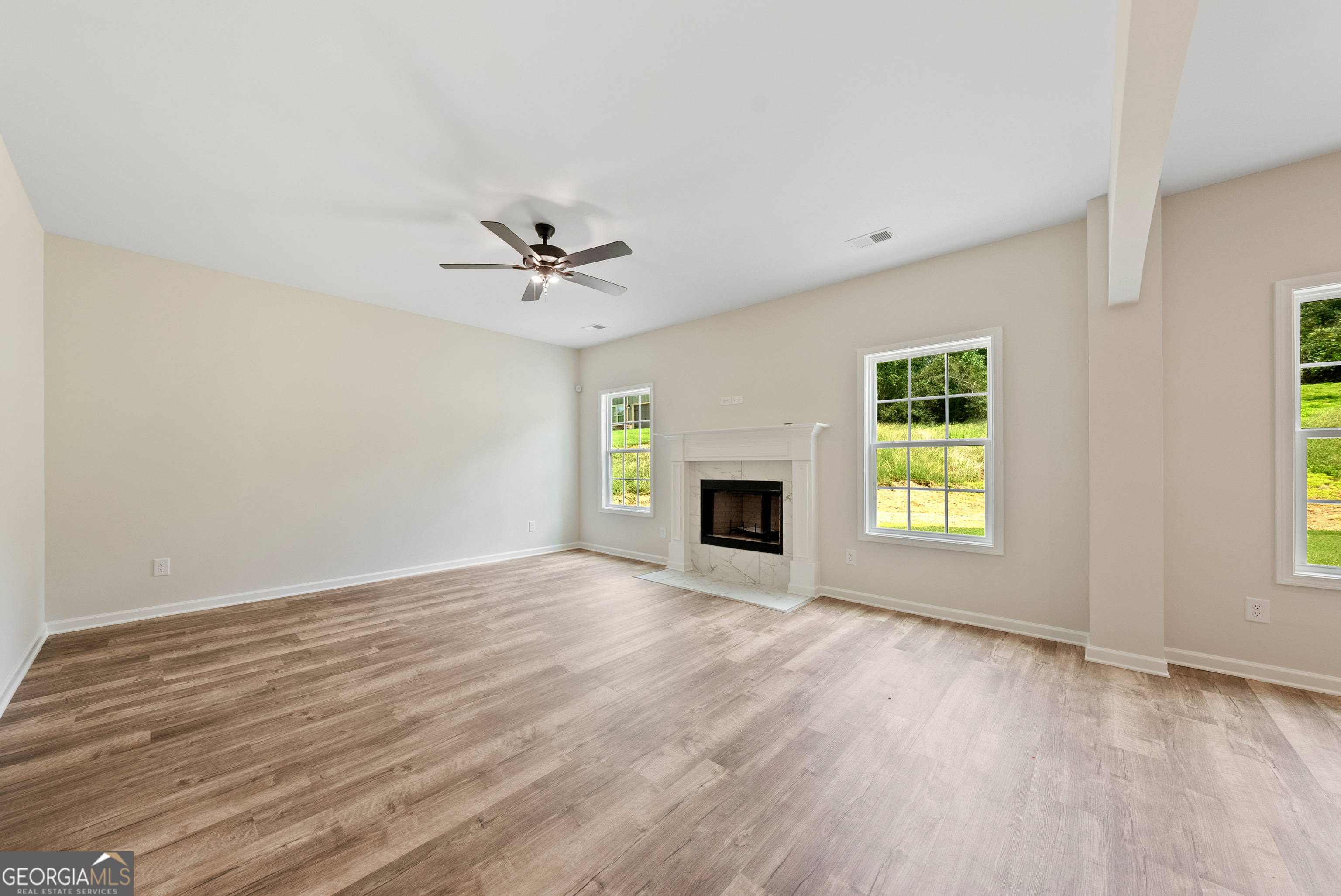 575 Bohannon Road, Unit 8 Grantville, GA 30220 - Photo 6 of 33 an empty room with windows and fireplace