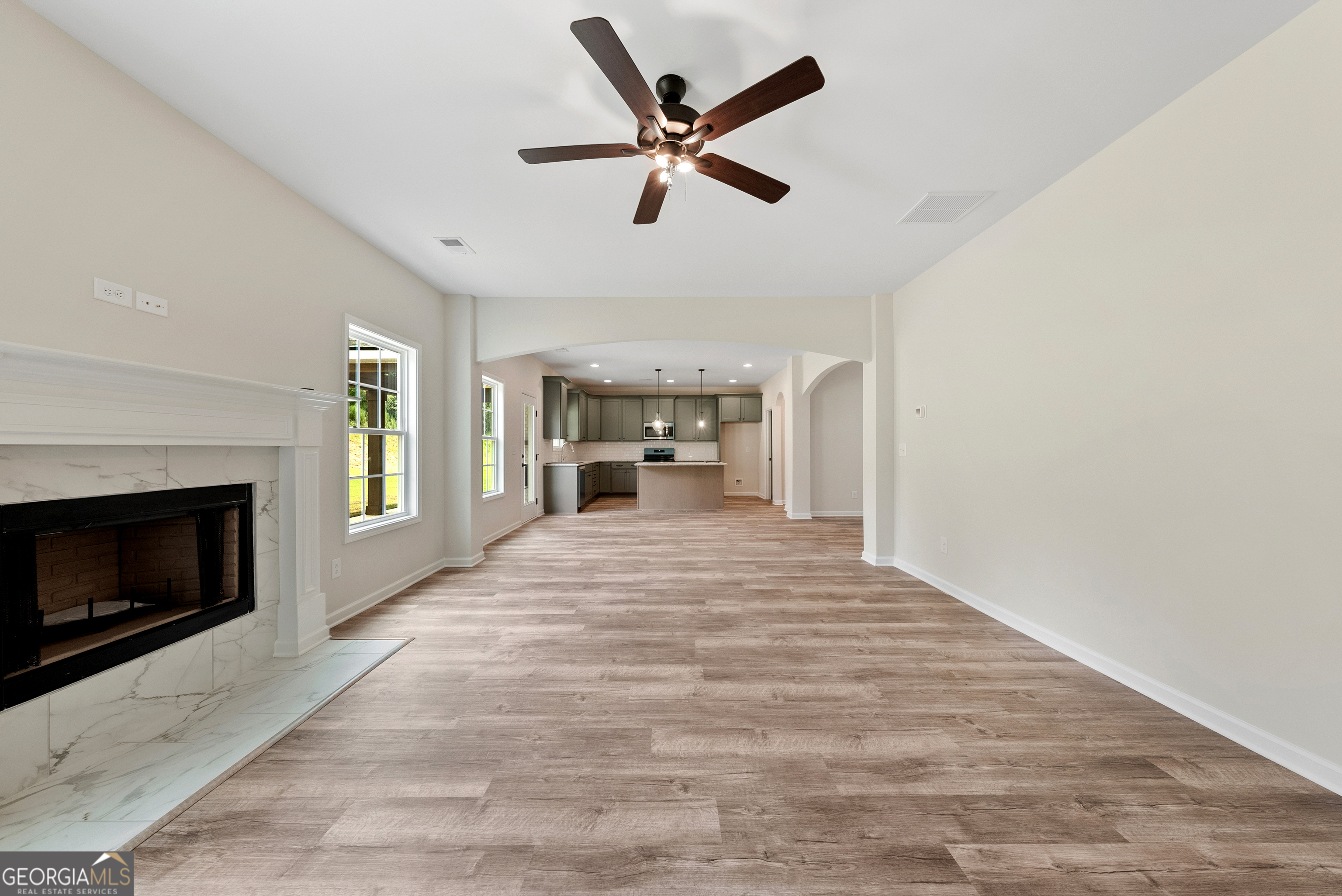 575 Bohannon Road, Unit 8 Grantville, GA 30220 - Photo 7 of 33 a workspace with fireplace cabinet and windows