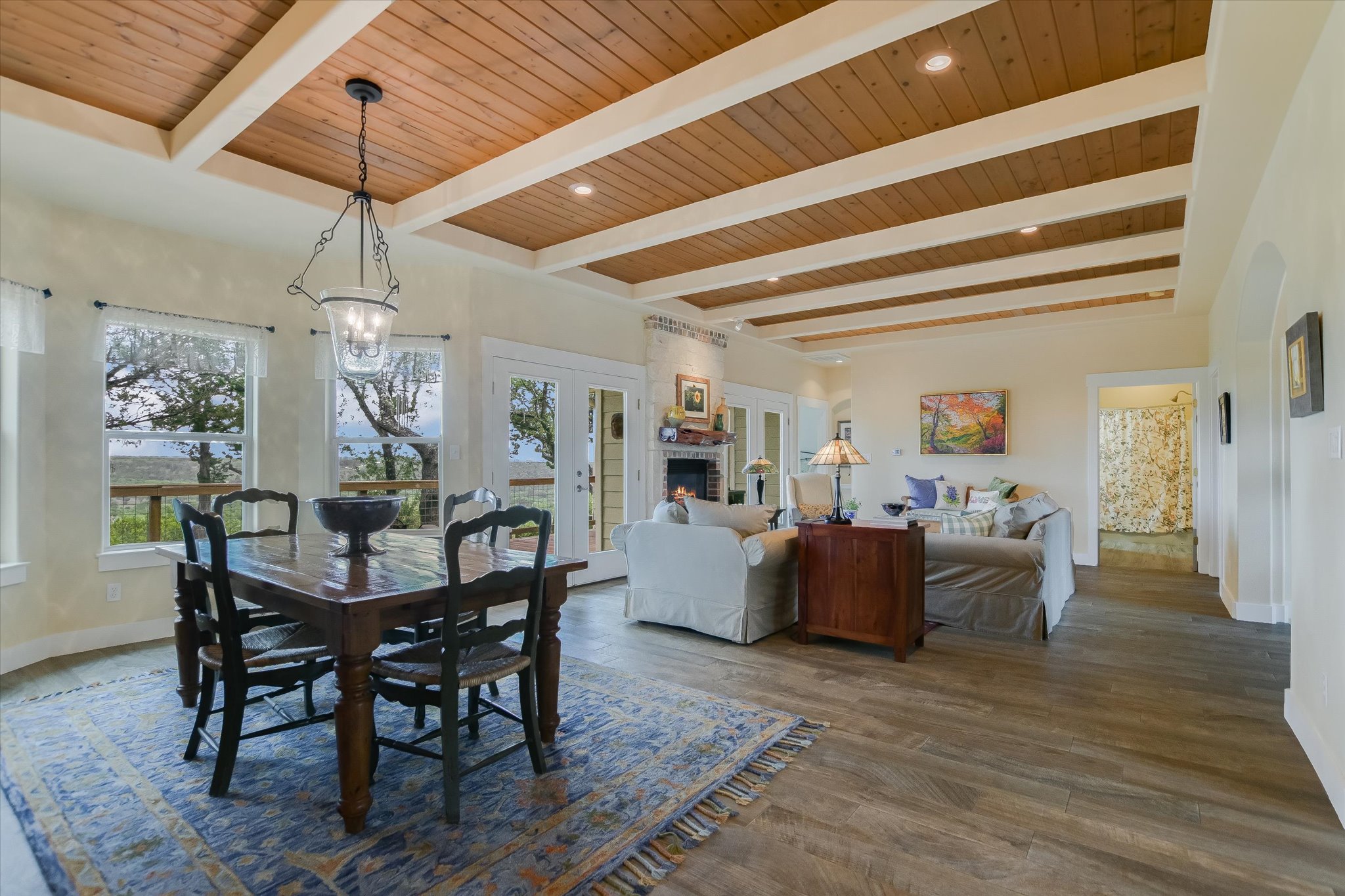 590 Rancho Grande Drive Wimberley, TX 78676 - Photo 11 of 30 a dining room with furniture window and wooden floor