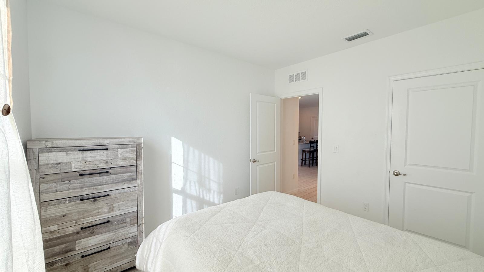 5154 Armina Place Fort Pierce, FL 34951 - Photo 19 of 38 a bed room with a bed and a view of closet