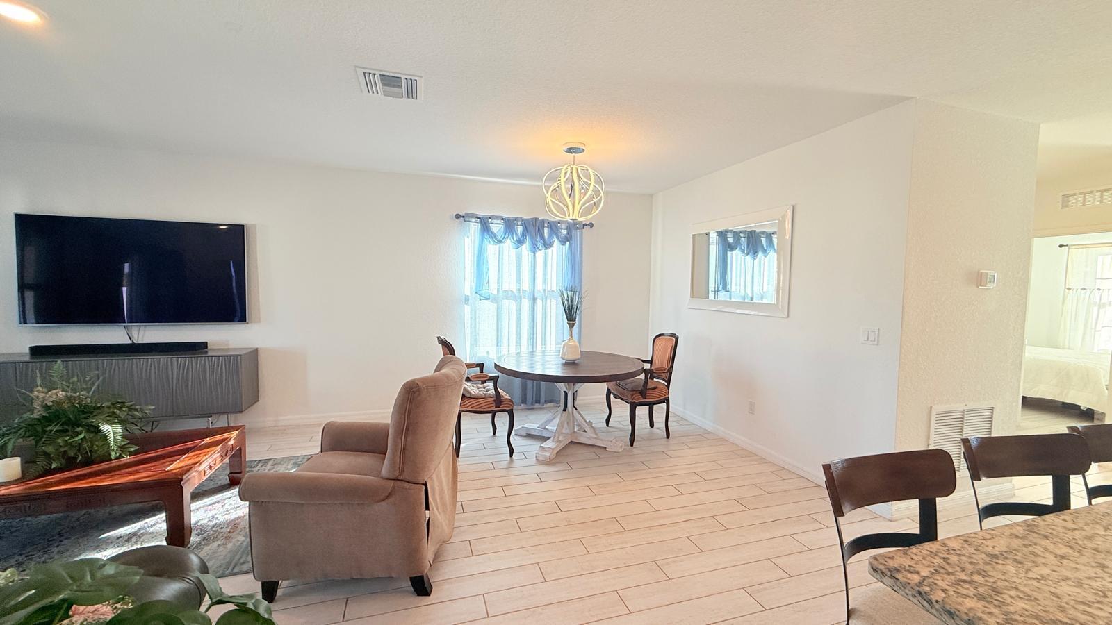 5154 Armina Place Fort Pierce, FL 34951 - Photo 22 of 38 a living room with furniture a lamp and a window