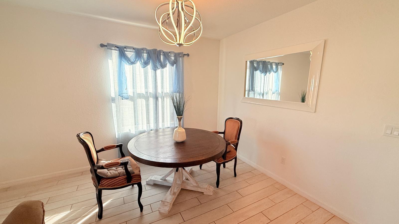 5154 Armina Place Fort Pierce, FL 34951 - Photo 23 of 38 a view of a dining room with furniture and window