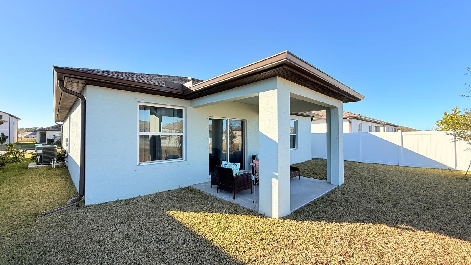 5154 Armina Place Fort Pierce, FL 34951 - Photo 35 of 38 a view of a house with a yard