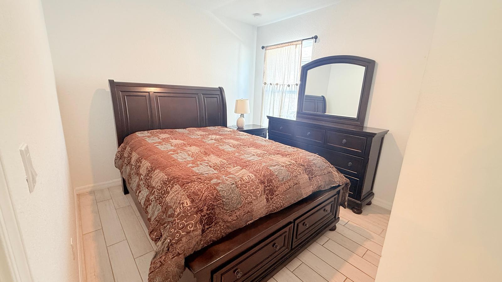 5154 Armina Place Fort Pierce, FL 34951 - Photo 8 of 38 a bed sitting in a bedroom next to a window