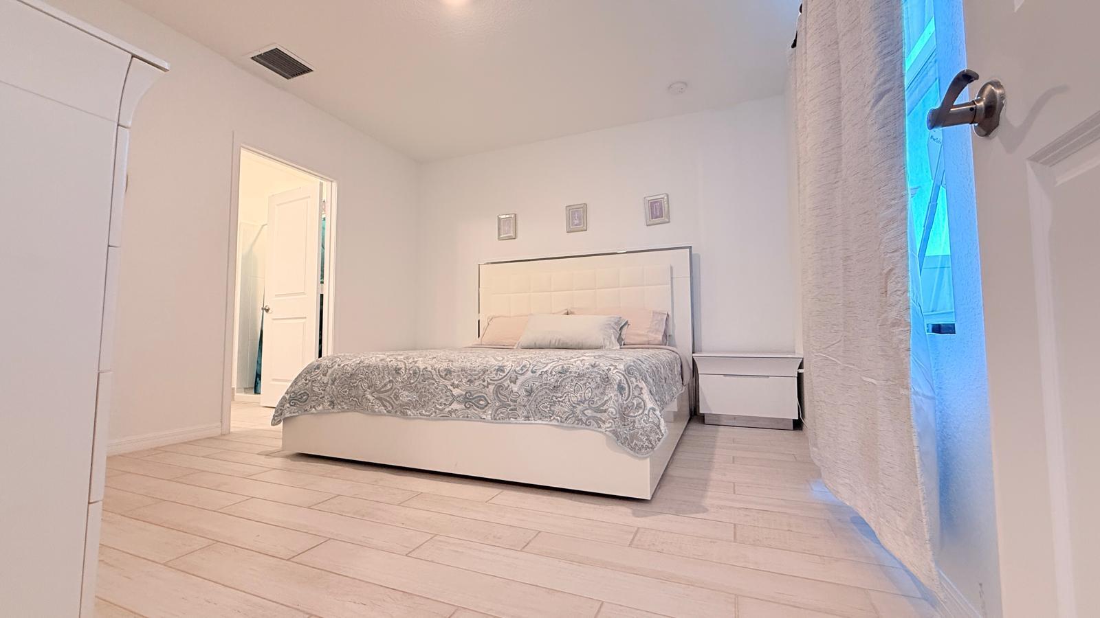 5154 Armina Place Fort Pierce, FL 34951 - Photo 9 of 38 a bedroom with a bed and a window