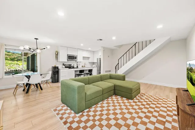 a living room with furniture and a table