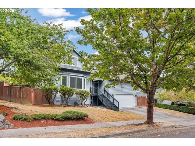 front view of house with a trees