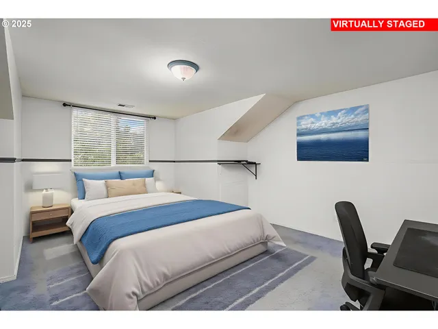 a bedroom with a bed and a desk