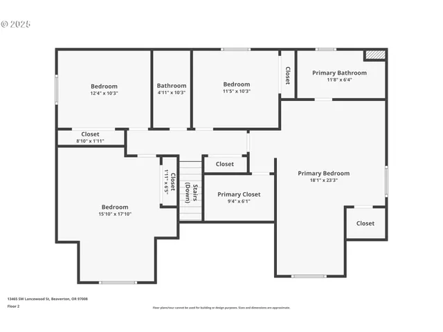 a view of an empty room with a window and a kitchen