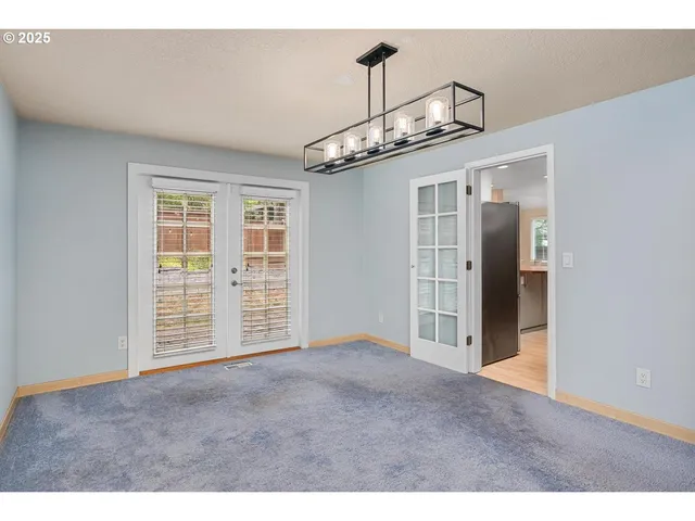 a view of a kitchen with furniture and a large window