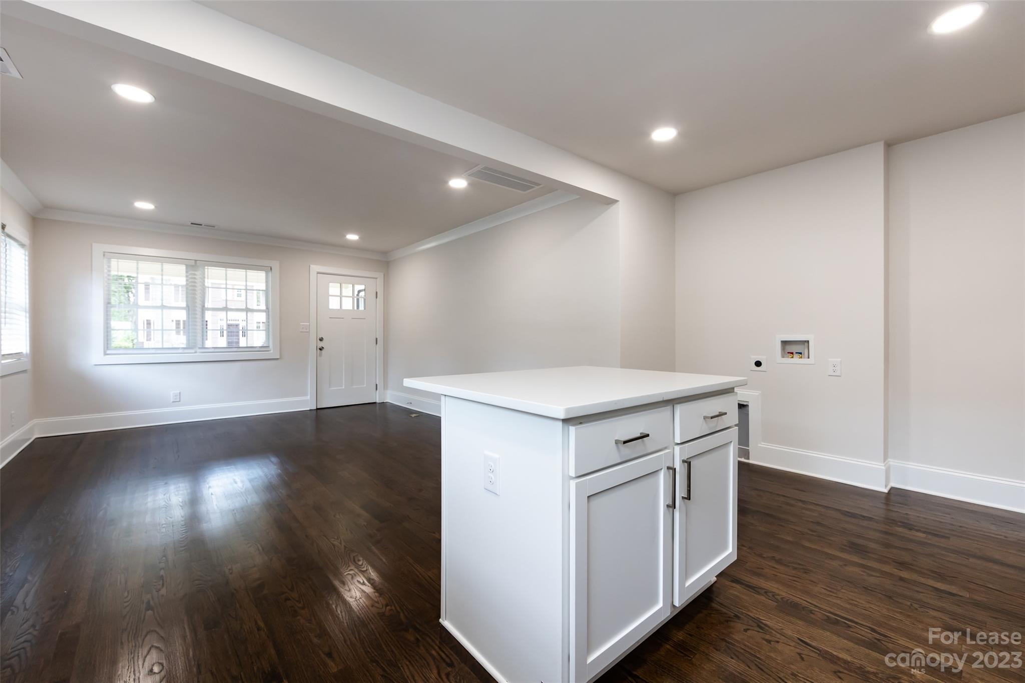 1704 Club Road, Unit A Charlotte, NC 28205 - Photo 19 of 35 an empty room with wooden floor and windows