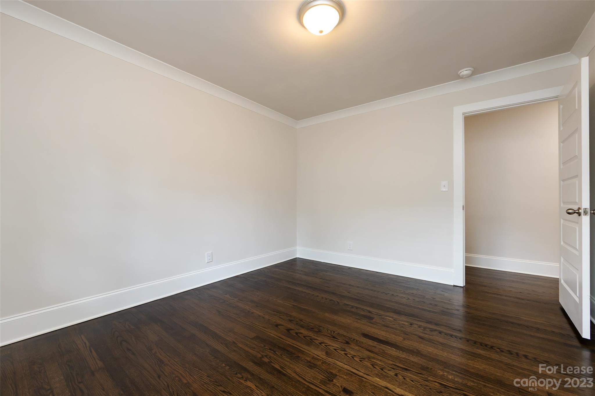 1704 Club Road, Unit A Charlotte, NC 28205 - Photo 24 of 35 a view of an empty room with wooden floor