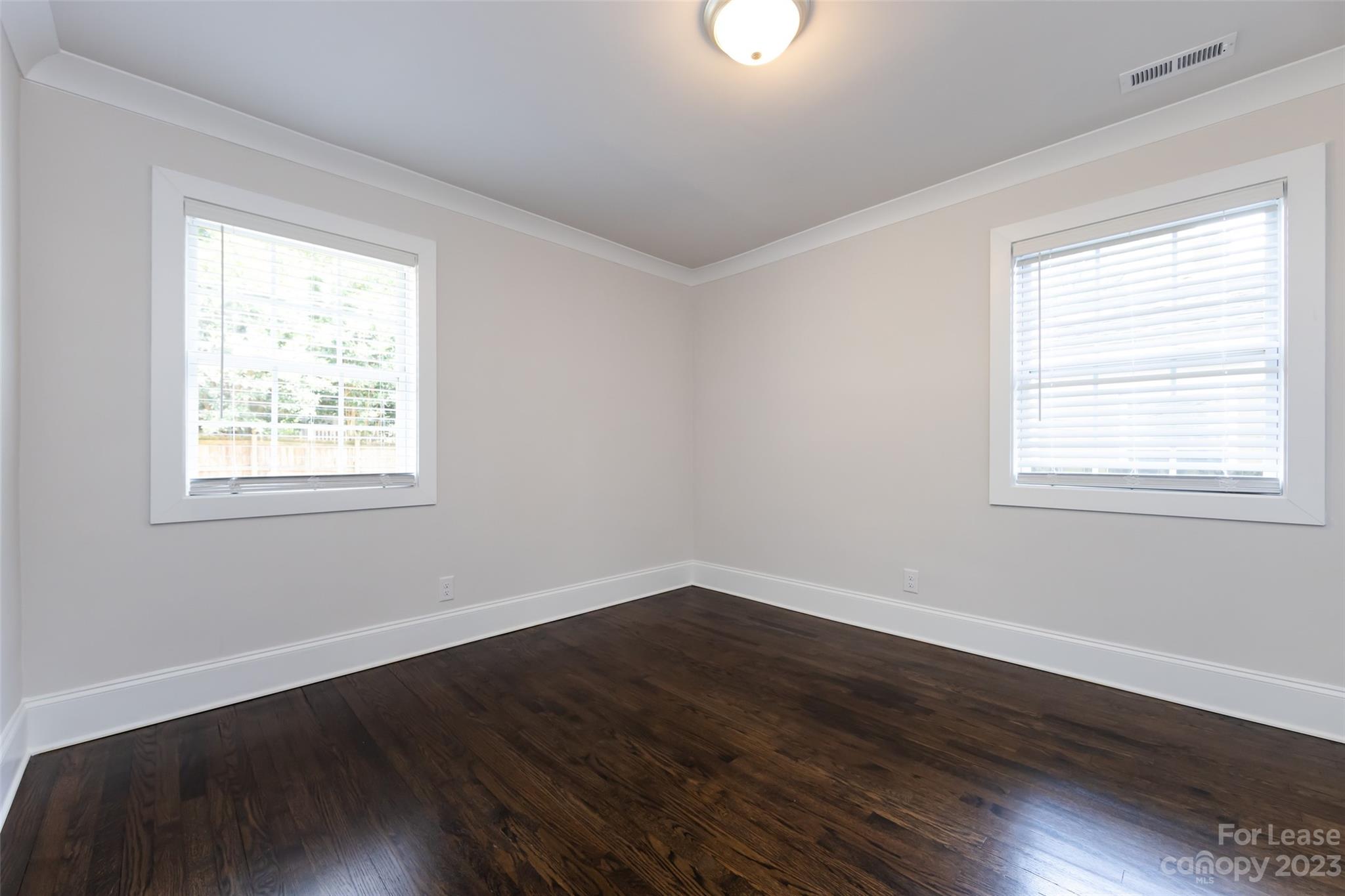 1704 Club Road, Unit A Charlotte, NC 28205 - Photo 29 of 35 a view of a room with wooden floor and windows in it