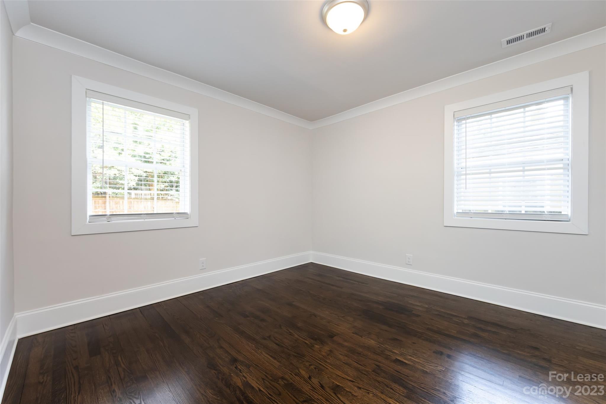 1704 Club Road, Unit A Charlotte, NC 28205 - Photo 30 of 35 a view of a room with wooden floor and windows in it