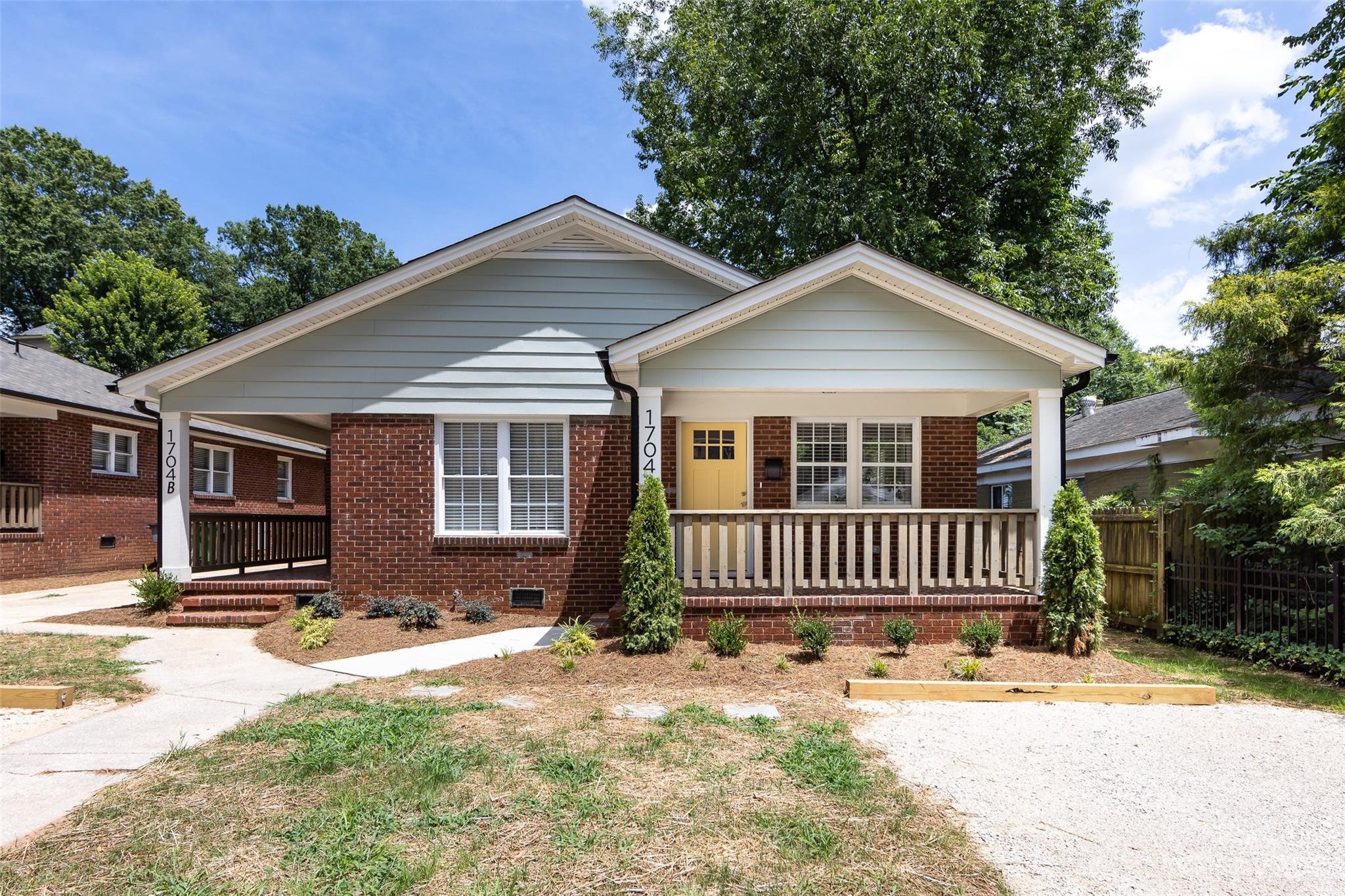 1704 Club Road, Unit A Charlotte, NC 28205 - Photo 3 of 35 a front view of a house with a yard
