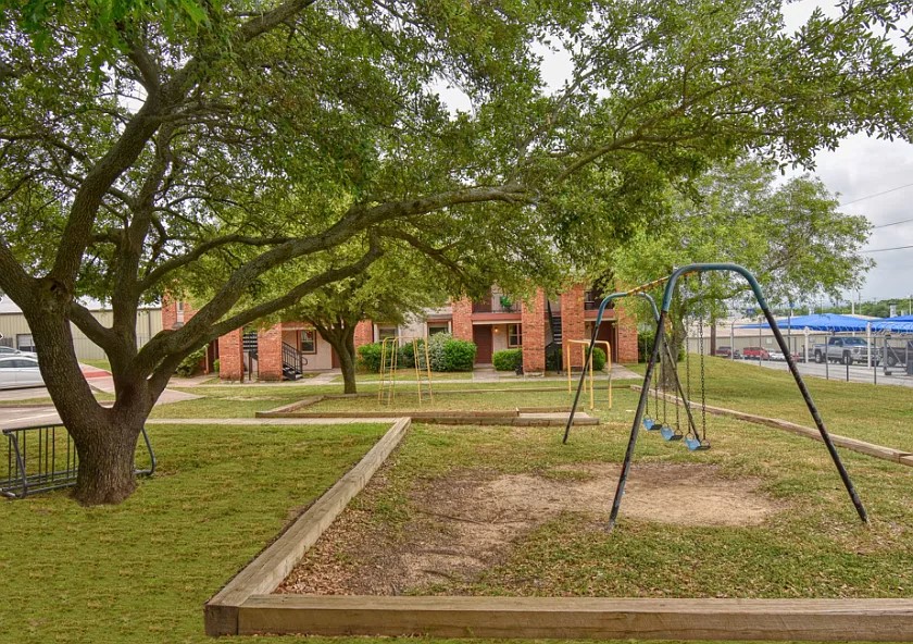 1906 South College Avenue Decatur, TX 76234 - Photo 5 of 6 a view of a park with large trees