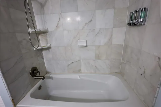 a close view of a bathtub in bathroom