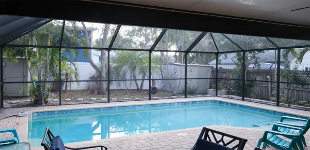 a view of a swimming pool with a patio
